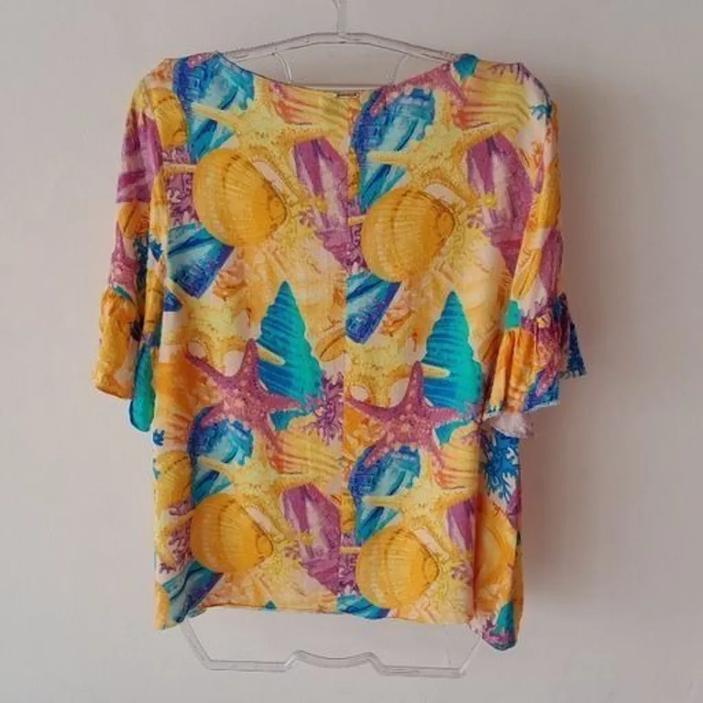 *ESTAMPA VIBRANTE* blusa manga curta flare estampada