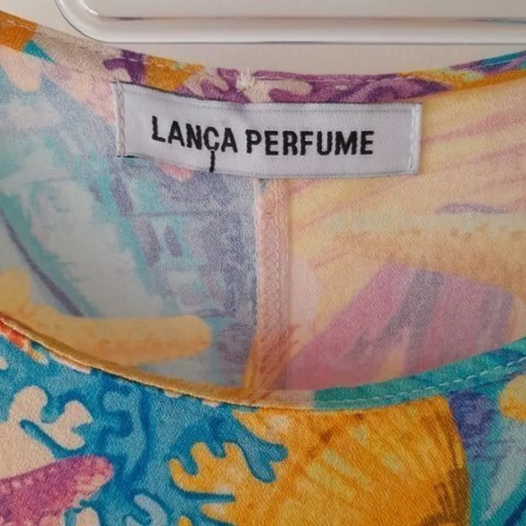 *ESTAMPA VIBRANTE* blusa manga curta flare estampada