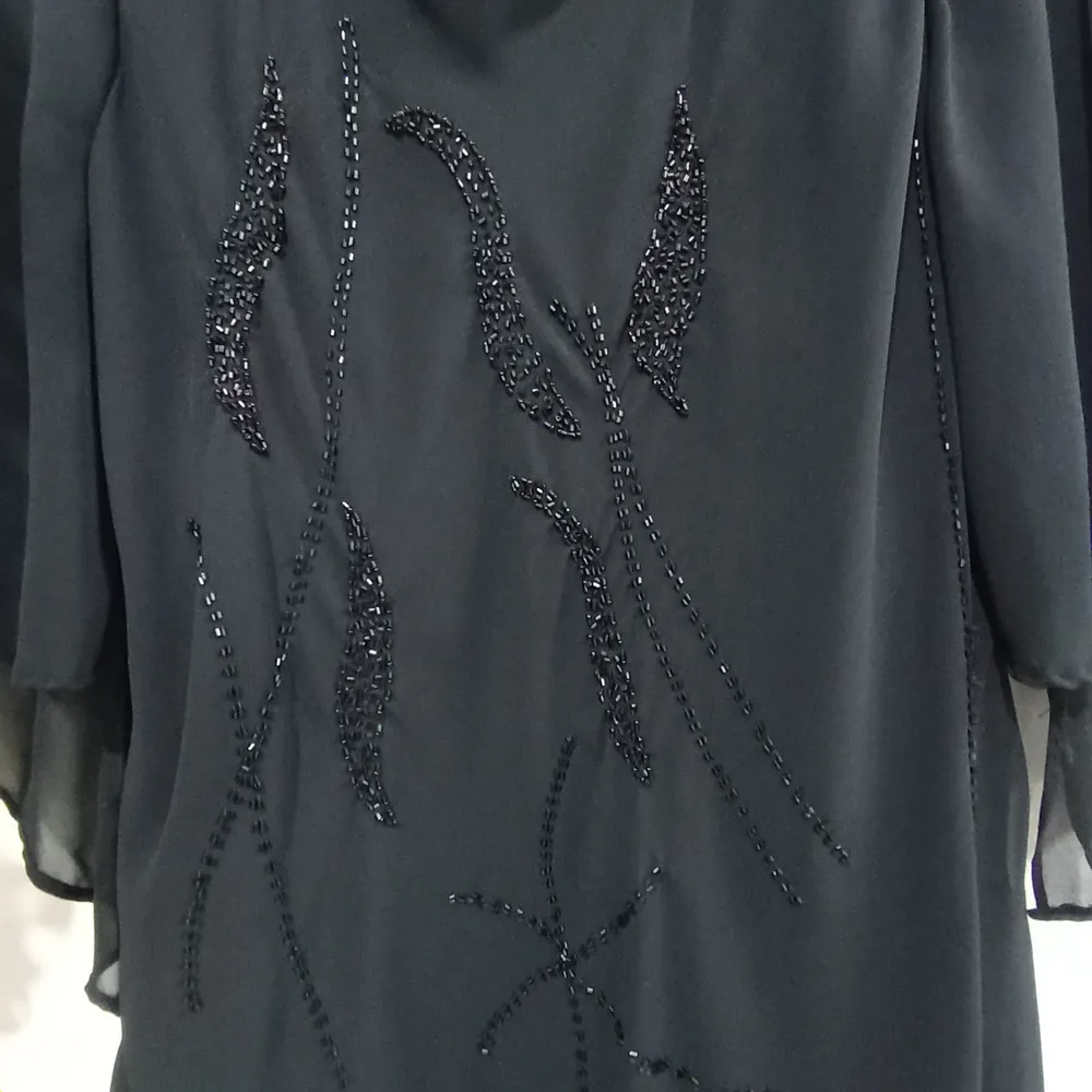 Blusa Preta Ampla com Mangas Morcego Tamanho P