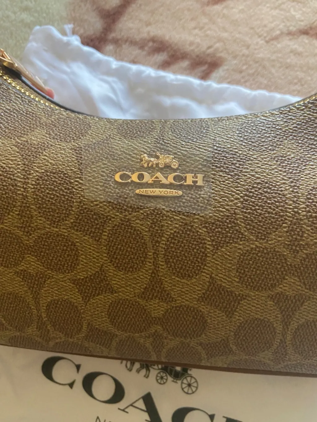 bolsa coach de ombro em couro