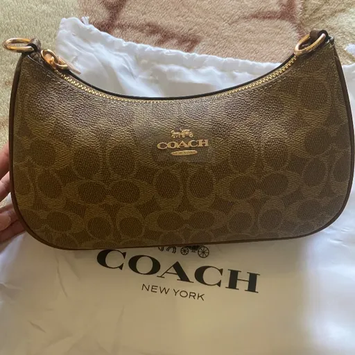 bolsa coach de ombro em couro