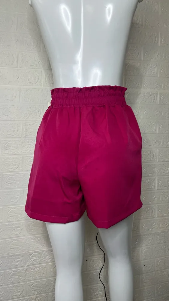 Shorts feminino alfaiataria rosa com laço