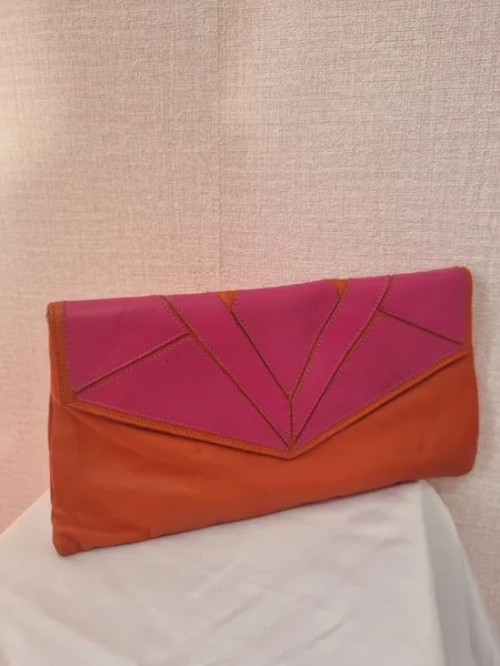 Carteira / bolsa de mão rosa e laranja em couro Iodice