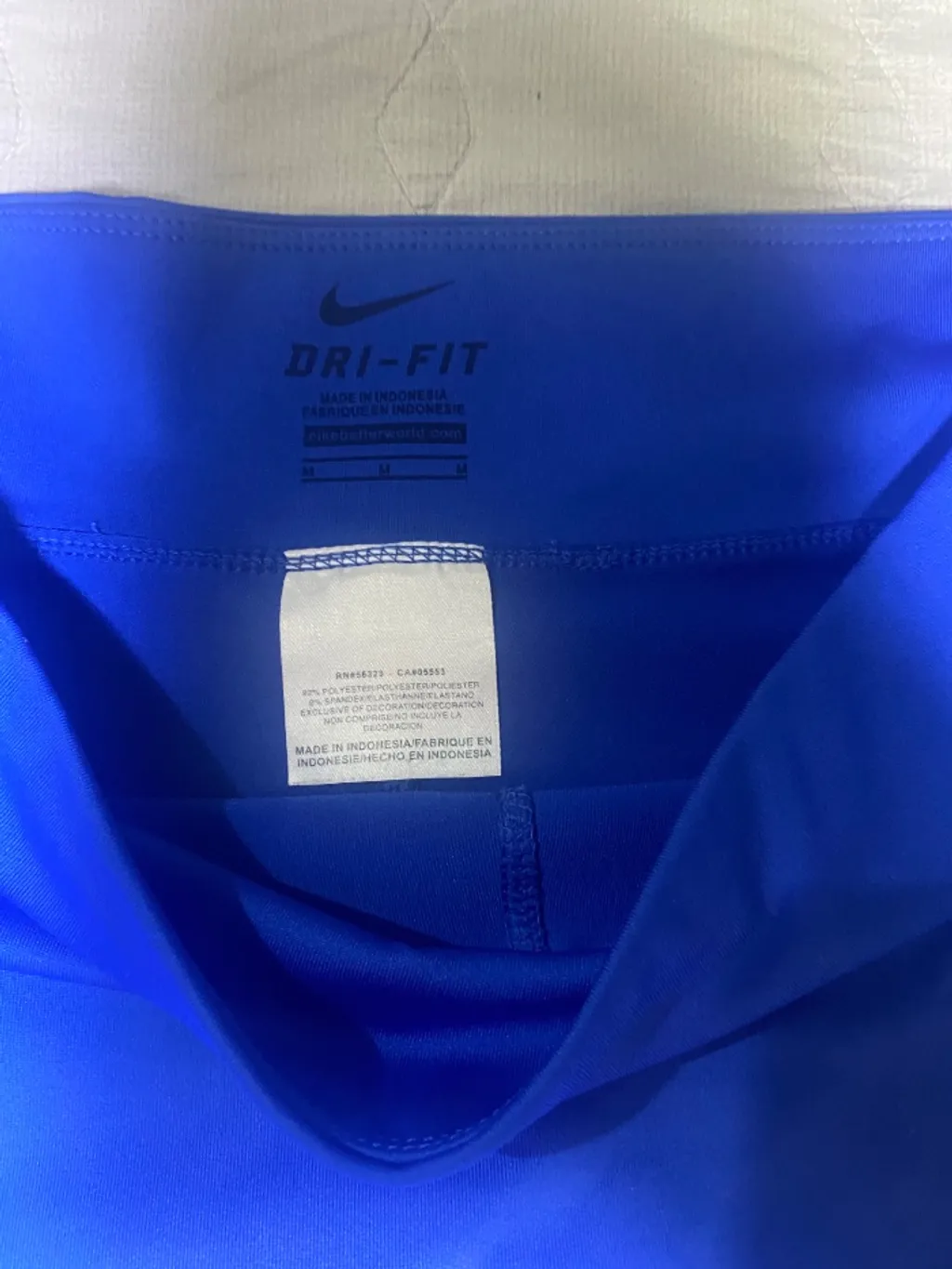 short saia nike azul