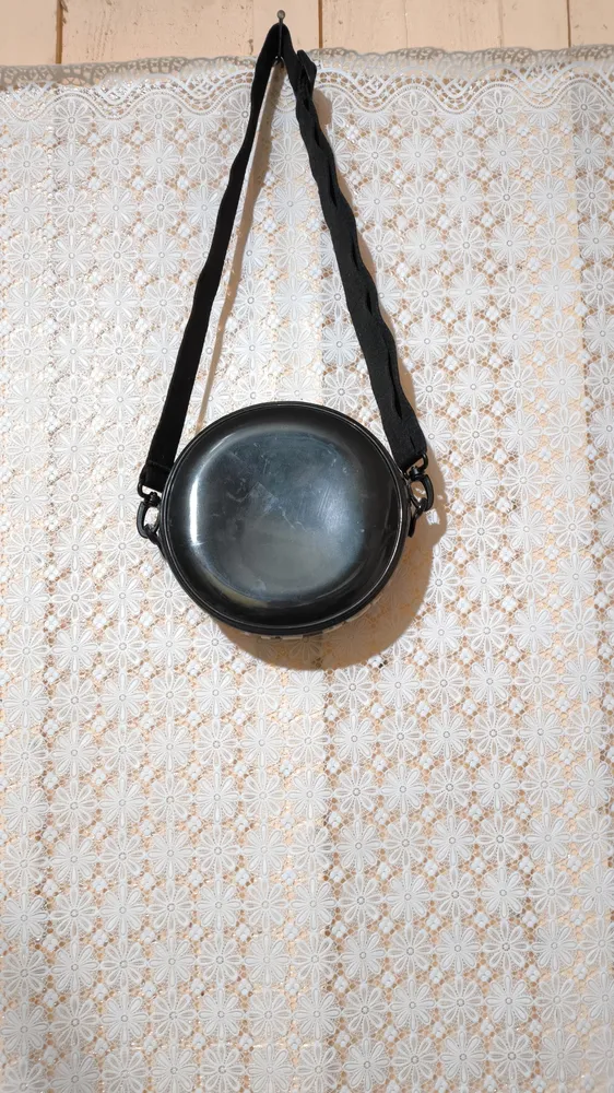 Bolsa Petite Jolie preta redonda