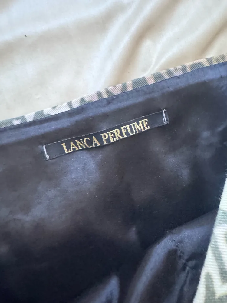 minissaia lanca perfume anos 2000 y2k animal print