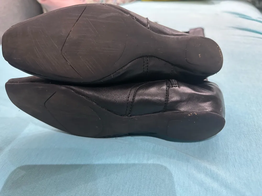 Bota cano alto em couro preto