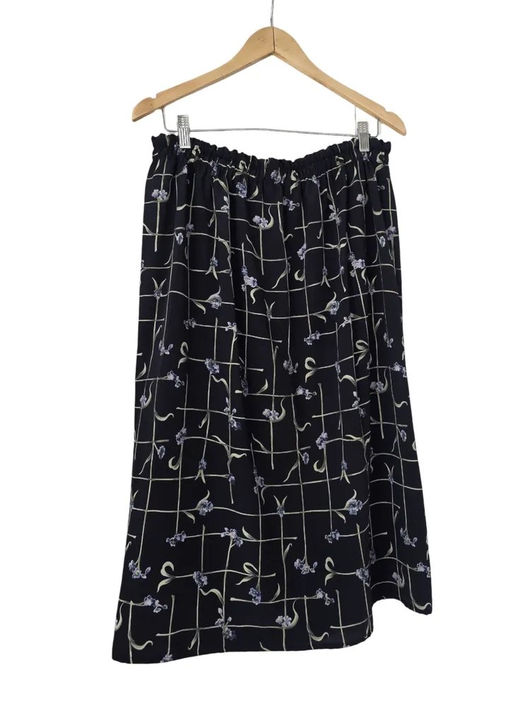 saia midi envelope floral preta